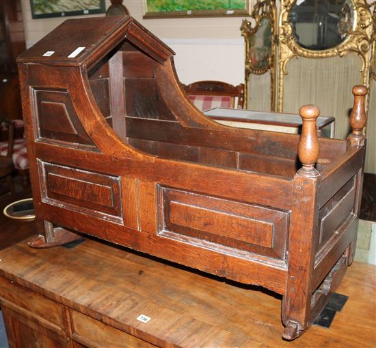 An early 18th century oak cradle, L.91cm